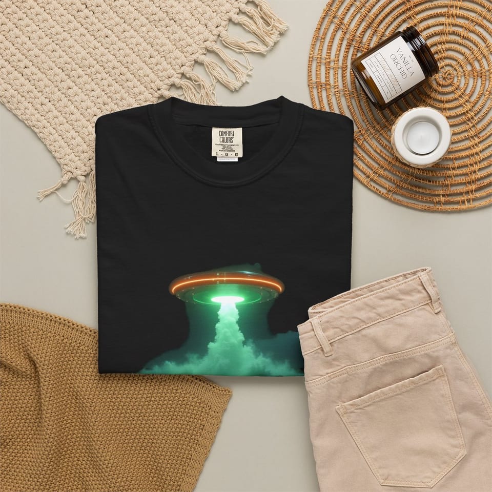 Transmedium Tee, folded 2 view (Printify product mockup)
