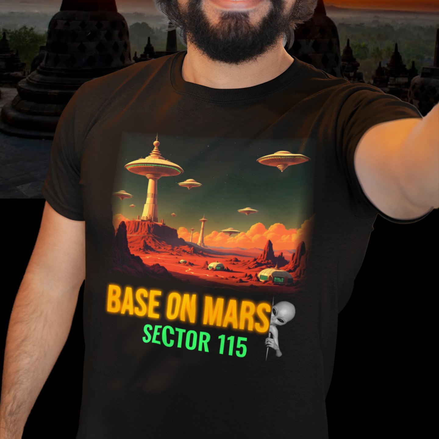 Base on Mars Retro T-shirt in Black, front print, worn by a model (temple at sunset). AI-edited photo: the real print artwork was digitally placed on a model photo.