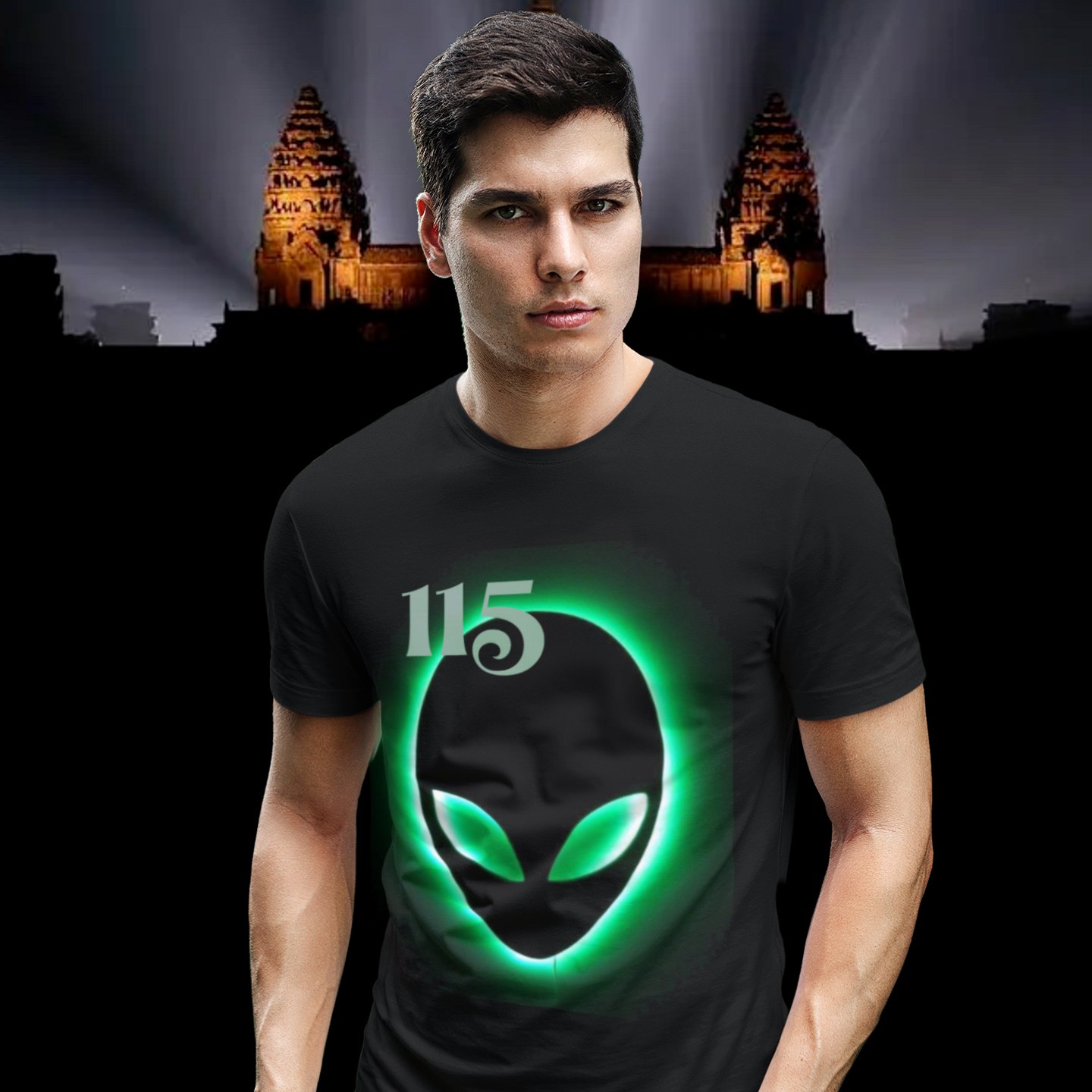 Element 115 – Glowing Alien Grey T-shirt in Black, front print, worn by a model (Angkor temple light beams). AI-edited photo: the real print artwork was digitally placed on a model photo.