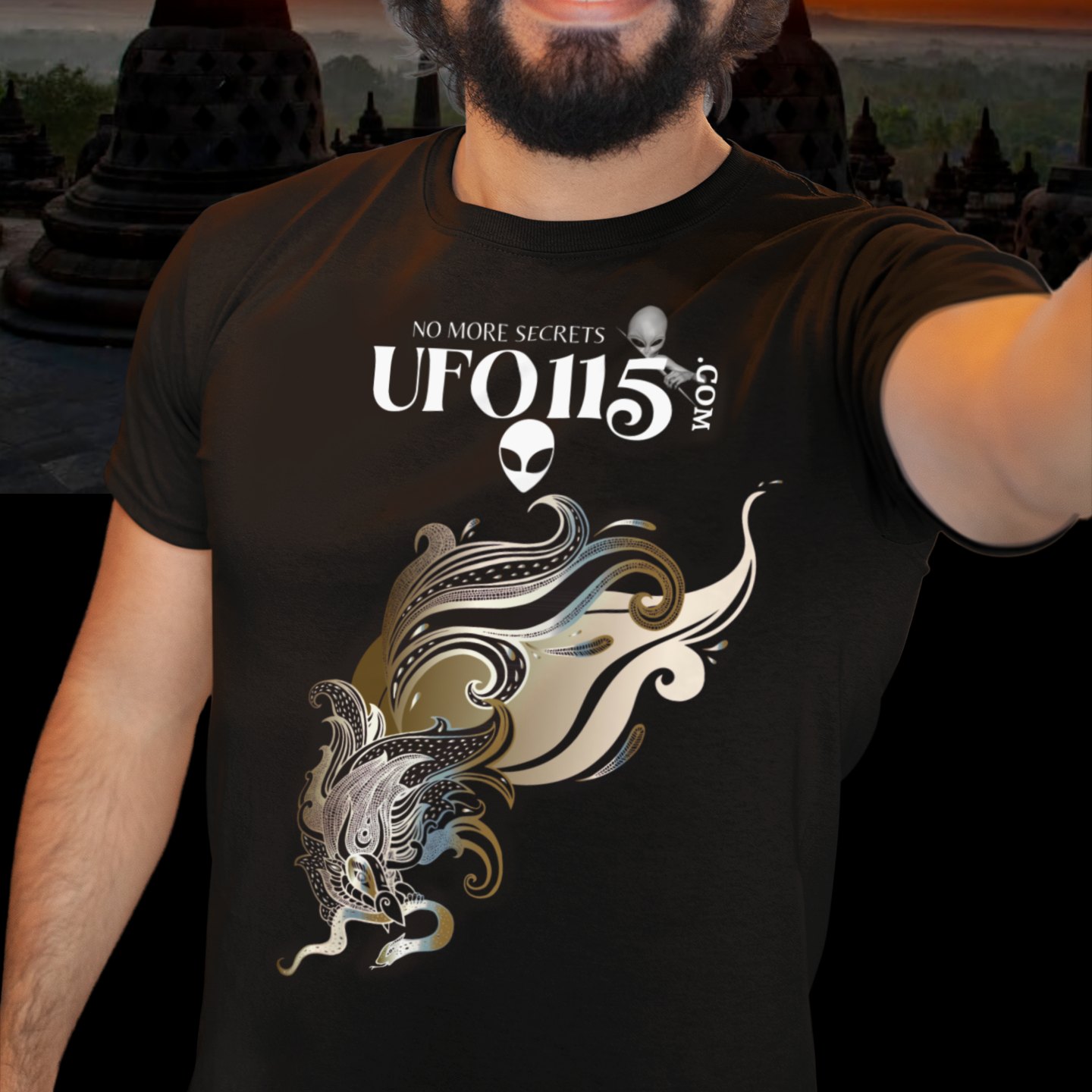 Garuda Bird T-shirt in Black, front print, worn by a model (temple at sunset). AI-edited photo: the real print artwork was digitally placed on a model photo.