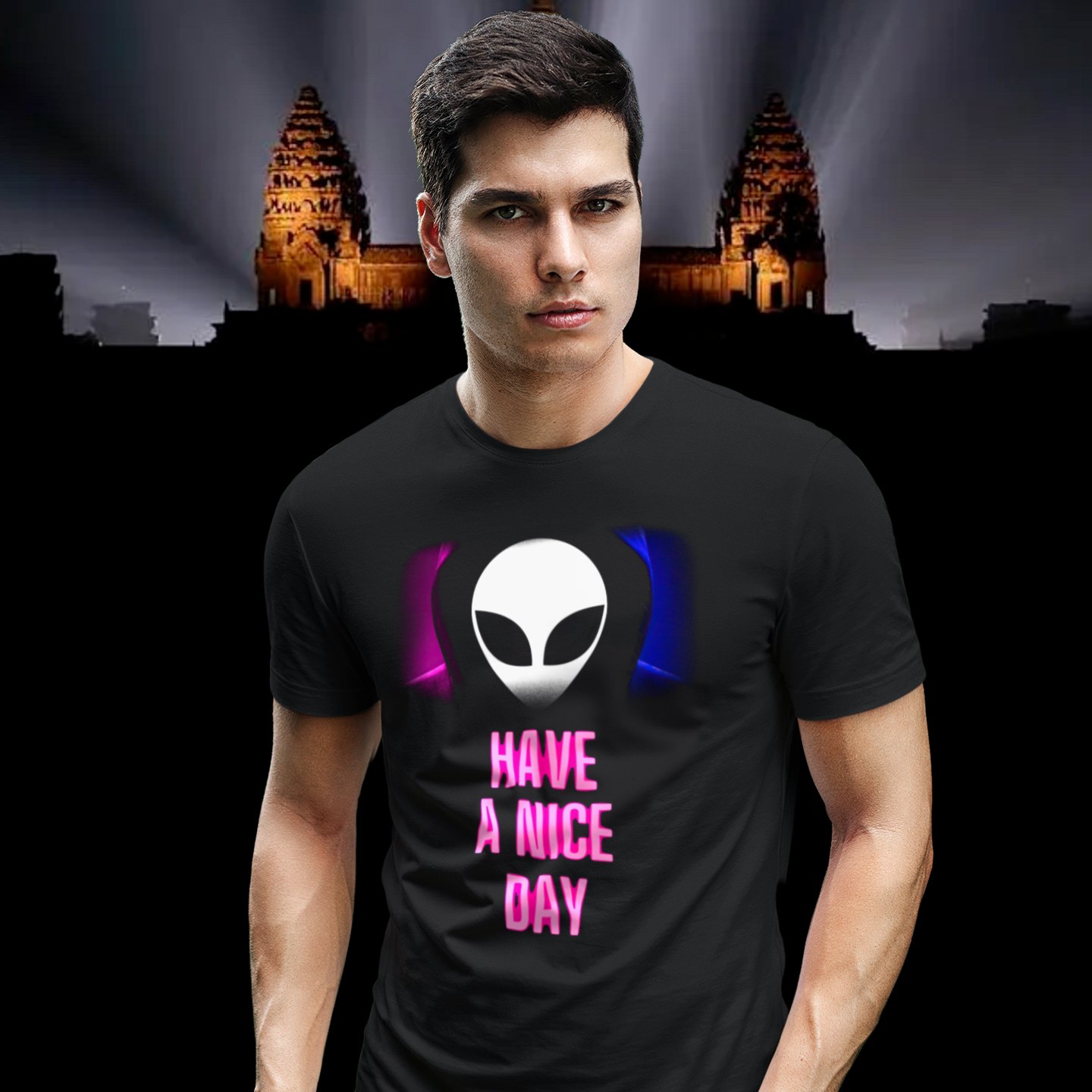 Have a Nice Day Alien T-shirt in Black, front print, worn by a model (Angkor temple light beams). AI-edited photo: the real print artwork was digitally placed on a model photo.