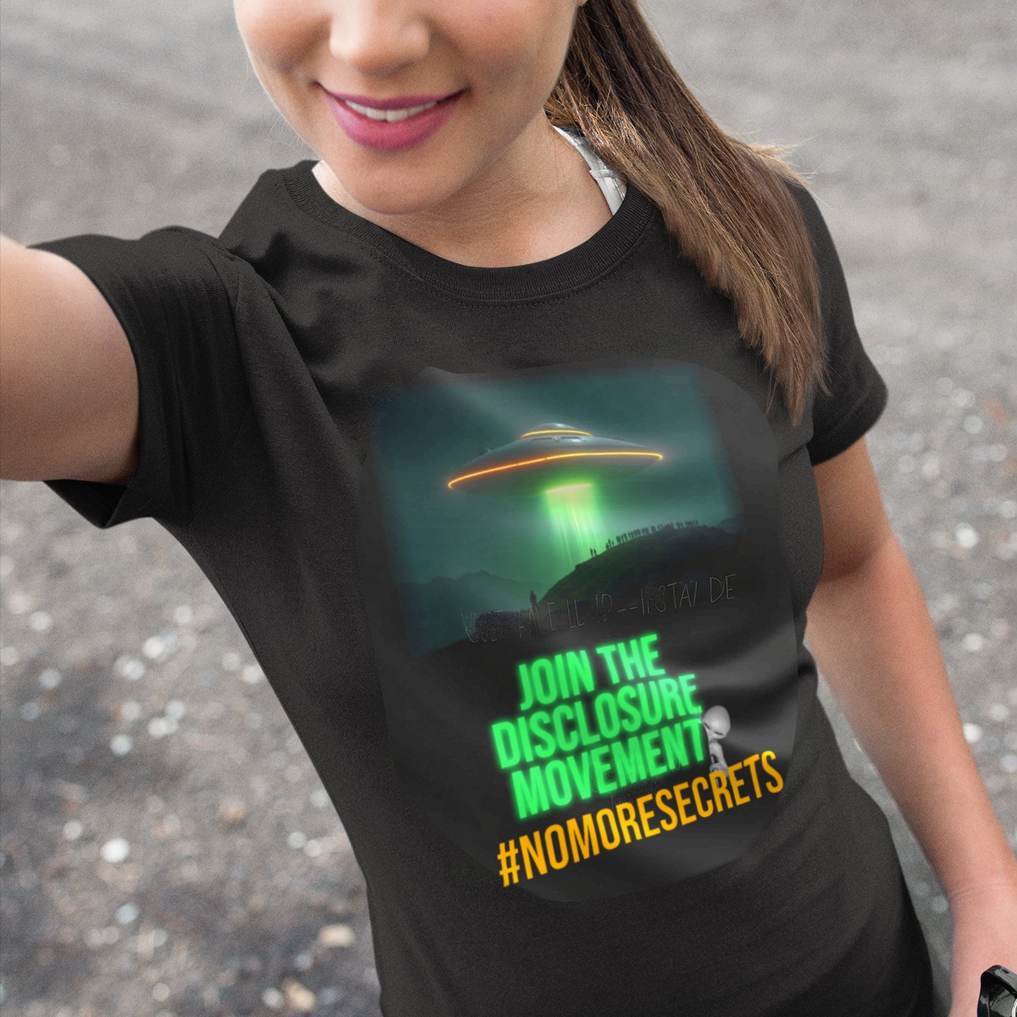 Join the Disclosure Movement T-shirt in Black, front print, worn by a model (outdoor selfie, day). AI-edited photo: the real print artwork was digitally placed on a model photo.
