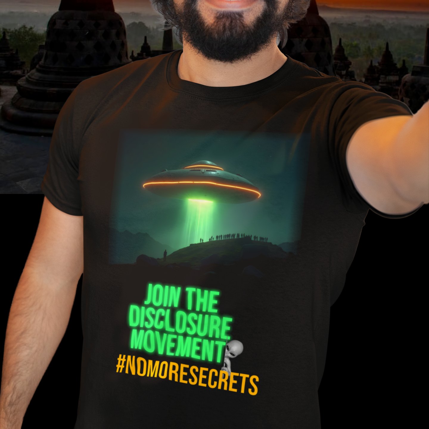 Join the Disclosure Movement T-shirt in Black, front print, worn by a model (temple at sunset). AI-edited photo: the real print artwork was digitally placed on a model photo.