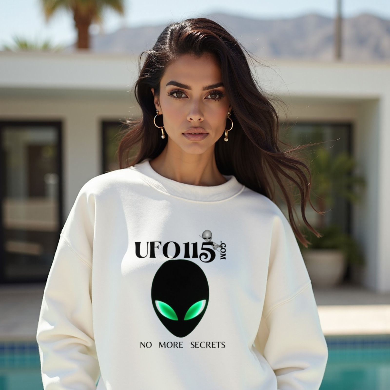 No More Secrets Green Eyes crewneck sweatshirt in White, worn by a model (beside a mid-century modern villa pool in Palm Springs). AI-generated image: model and scene are AI-generated; the print is the real artwork.