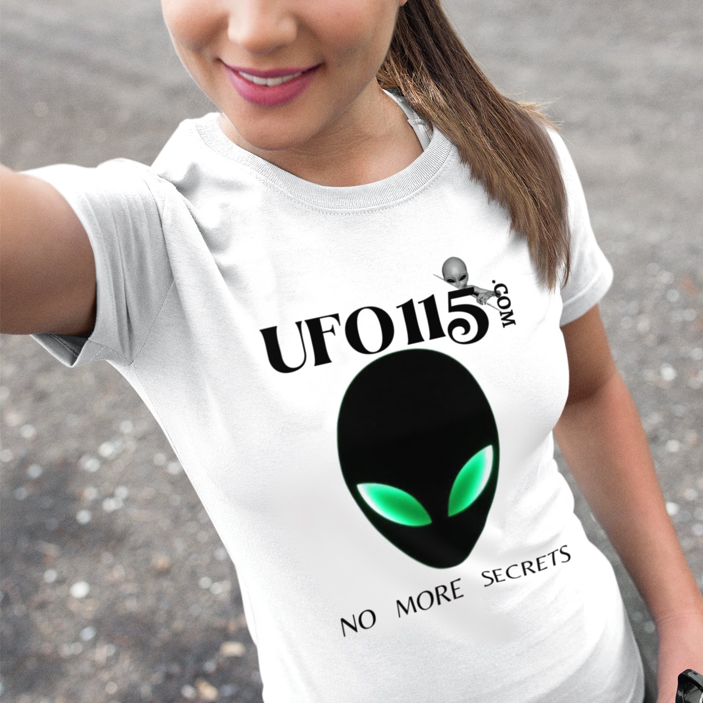 No More Secrets Green Eyes T-shirt in White, front print, worn by a model (outdoor selfie, day). AI-edited photo: the real print artwork was digitally placed on a model photo.