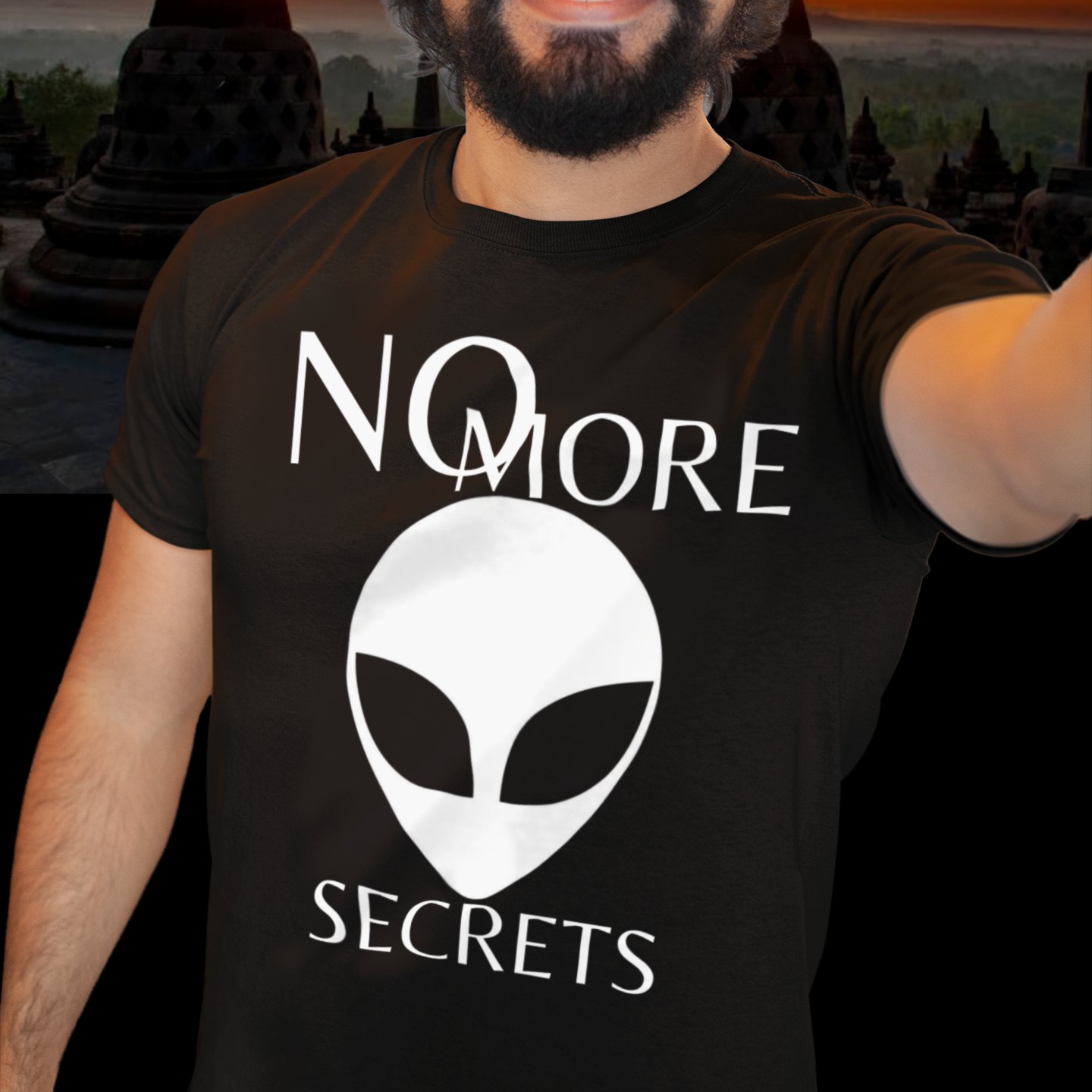 No More Secrets Porton Down T-shirt in Black, front print, worn by a model (temple at sunset). AI-edited photo: the real print artwork was digitally placed on a model photo.
