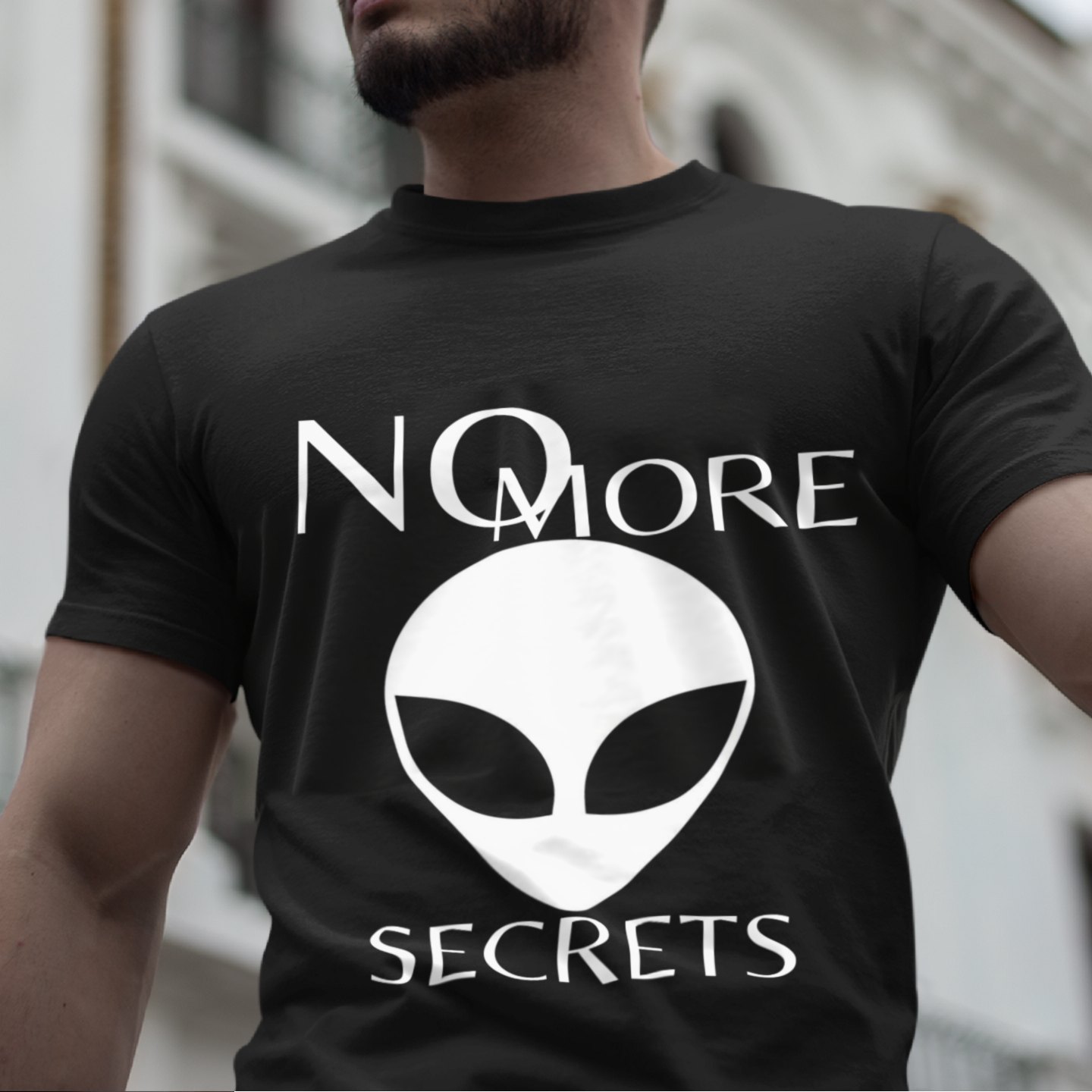 No More Secrets South China Sea T-shirt in Black, front print, worn by a model (classic architecture, day). AI-edited photo: the real print artwork was digitally placed on a model photo.