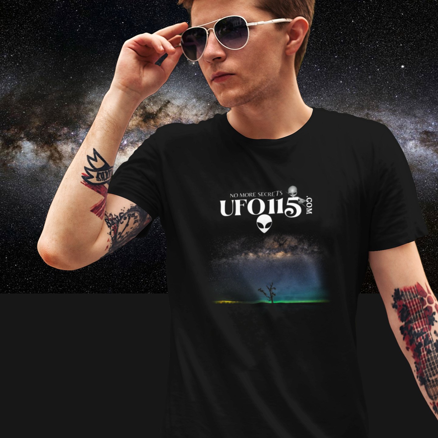 Sky Watcher Glowy Nights T-shirt in Black, front print, worn by a model (Milky Way night). AI-edited photo: the real print artwork was digitally placed on a model photo.