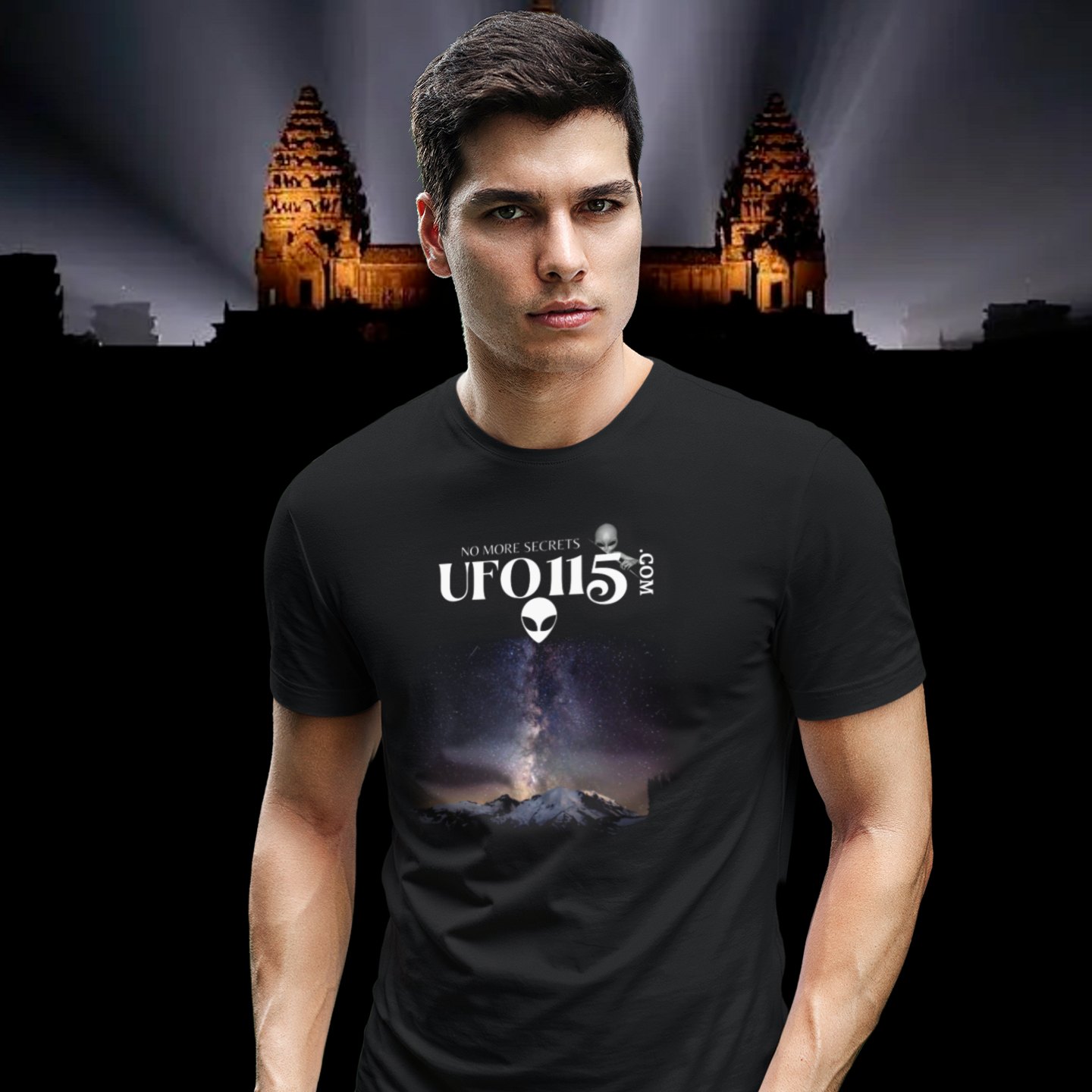 Sky Watcher Mountain Light T-shirt in Black, front print, worn by a model (Angkor temple light beams). AI-edited photo: the real print artwork was digitally placed on a model photo.