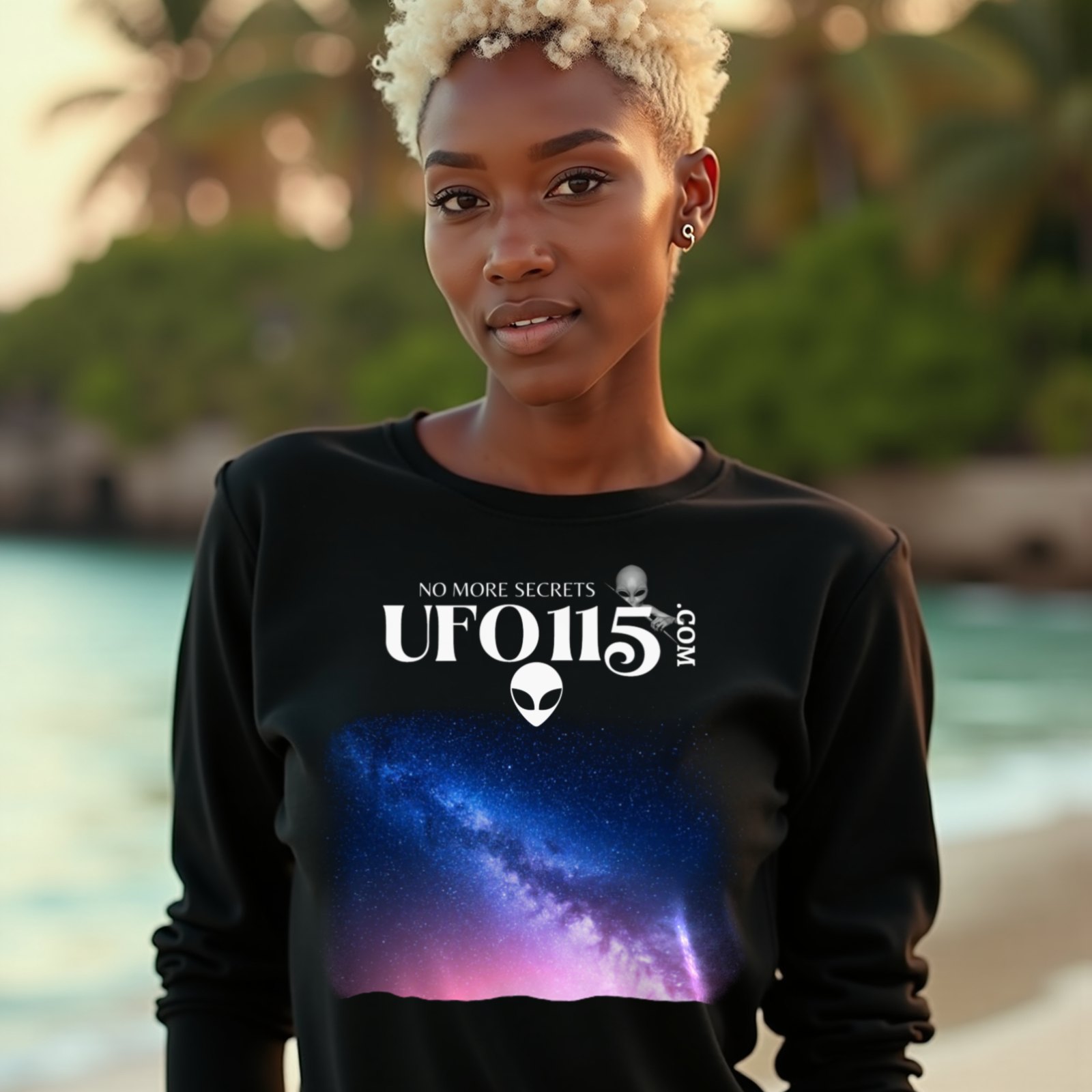 Sky Watcher Pretty in Pink long-sleeve T-shirt in Black, worn by a model (on a tropical beach at golden hour). AI-generated image: model and scene are AI-generated; the print is the real artwork.