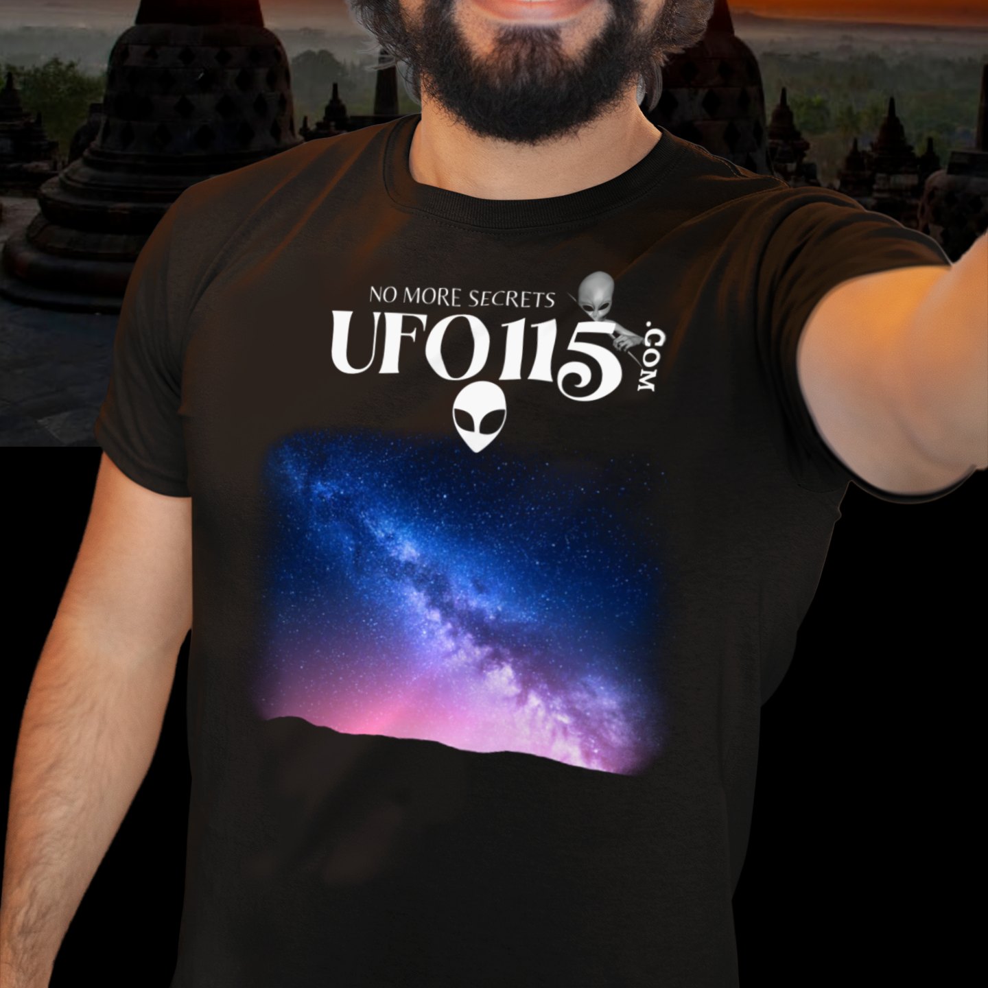 Sky Watcher Pretty in Pink T-shirt in Black, front print, worn by a model (temple at sunset). AI-edited photo: the real print artwork was digitally placed on a model photo.