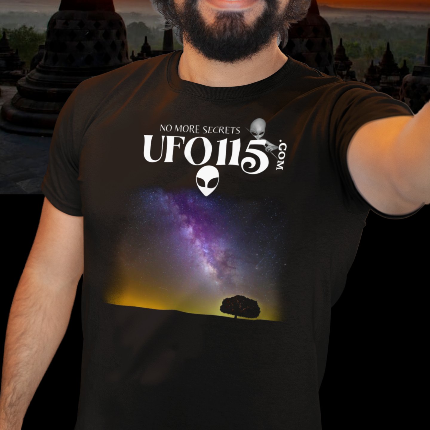 Sky Watcher Purple Star Dust T-shirt in Black, front print, worn by a model (temple at sunset). AI-edited photo: the real print artwork was digitally placed on a model photo.
