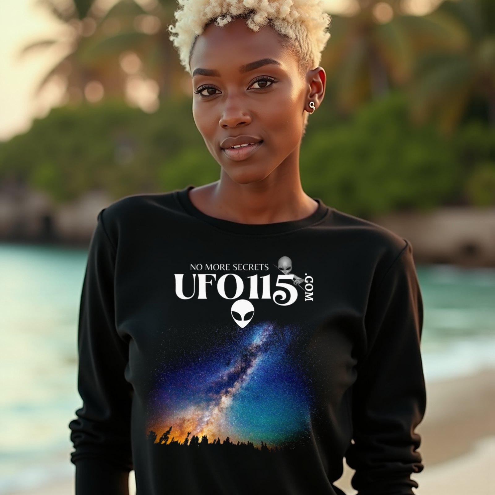 Sky Watcher Rainbow Bridge long-sleeve T-shirt in Black, worn by a model (on a tropical beach at golden hour). AI-generated image: model and scene are AI-generated; the print is the real artwork.