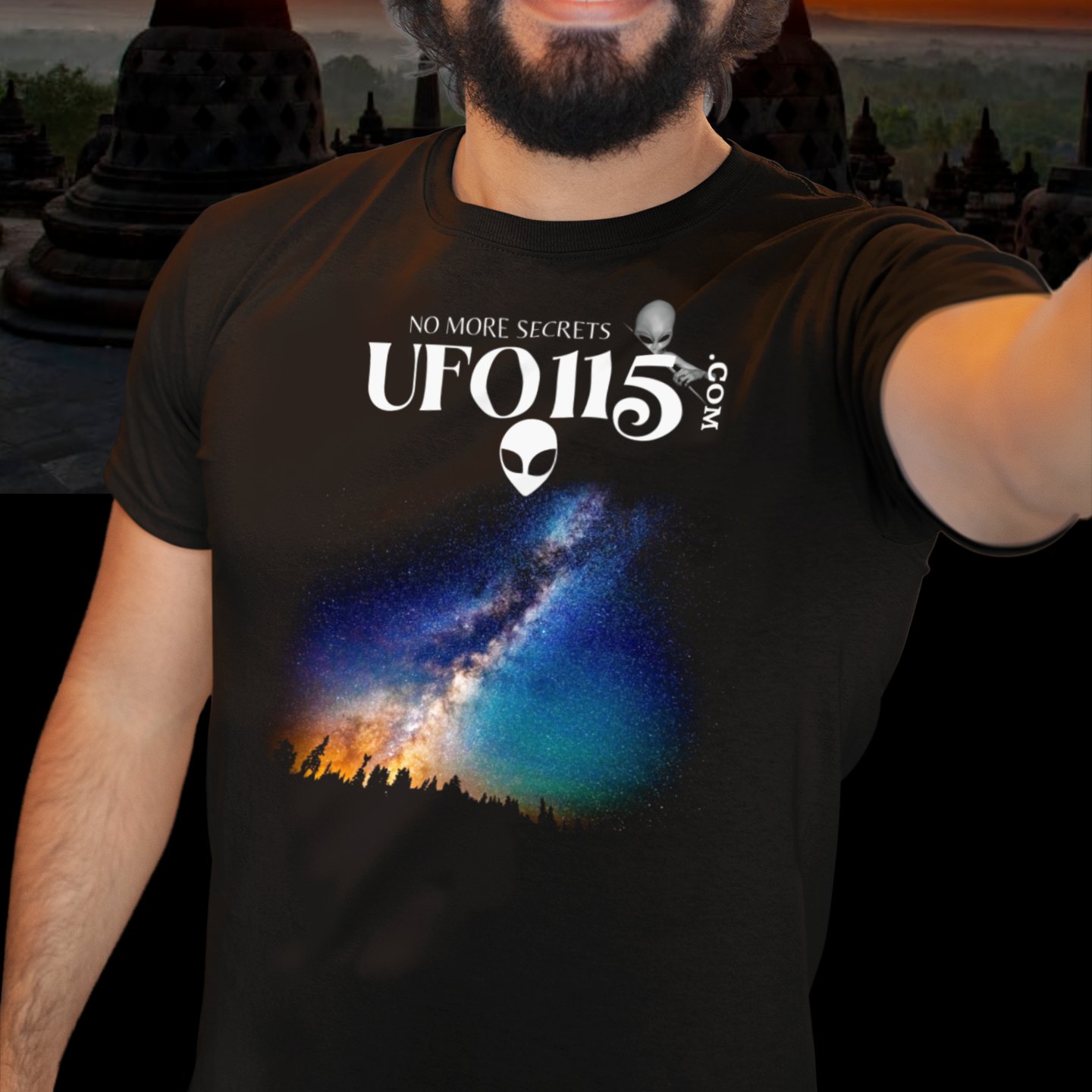 Sky Watcher Rainbow Bridge T-shirt in Black, front print, worn by a model (temple at sunset). AI-edited photo: the real print artwork was digitally placed on a model photo.