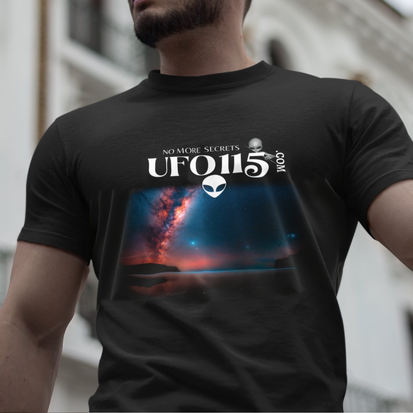 Sky Watcher – Ring of Fire T-shirt in Black, front print, worn by a model (classic architecture, day). AI-edited photo: the real print artwork was digitally placed on a model photo.