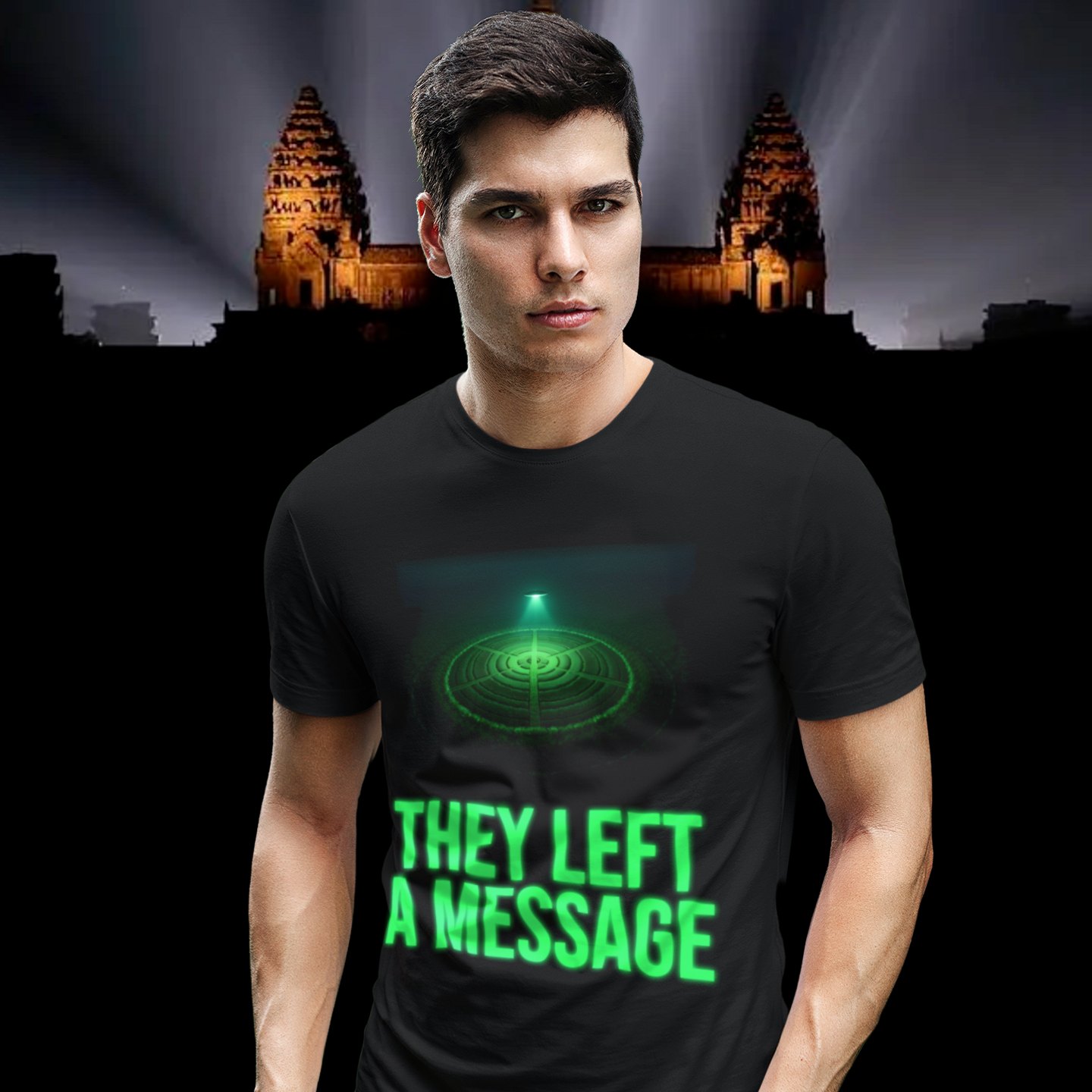 They Left a Message T-shirt in Black, front print, worn by a model (Angkor temple light beams). AI-edited photo: the real print artwork was digitally placed on a model photo.