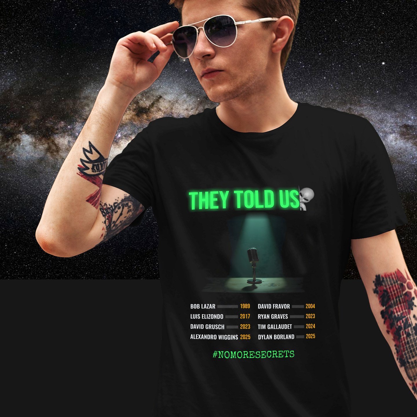 They Told Us T-shirt in Black, front print, worn by a model (Milky Way night). AI-edited photo: the real print artwork was digitally placed on a model photo.