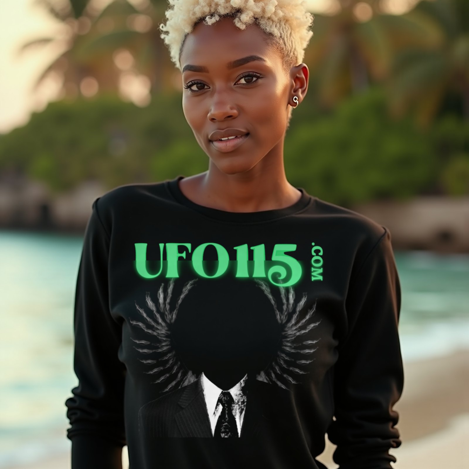 UFO115 – Green Angel long-sleeve T-shirt in Black, worn by a model (on a tropical beach at golden hour). AI-generated image: model and scene are AI-generated; the print is the real artwork.