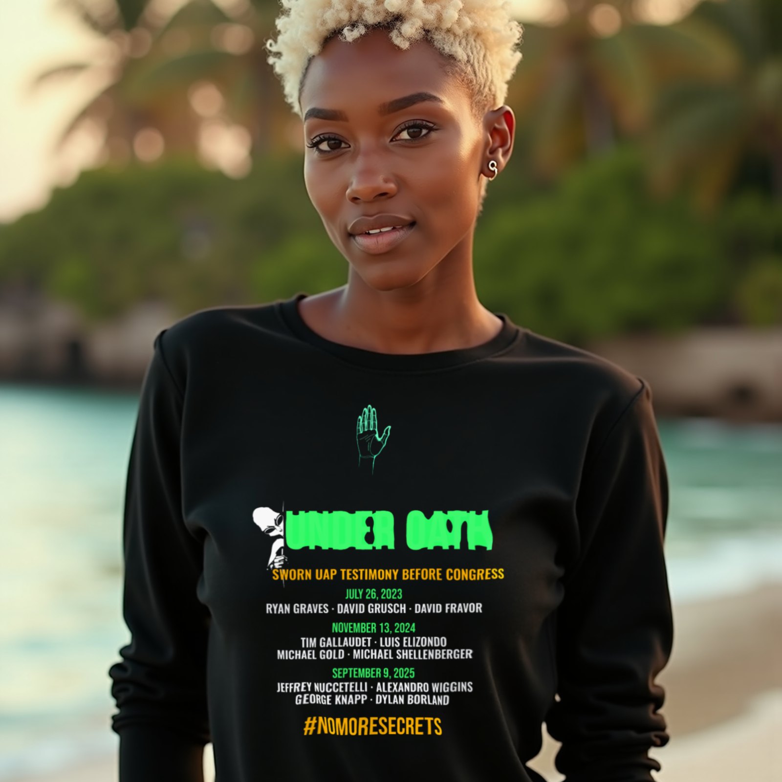 Under Oath UAP Testimony long-sleeve T-shirt in Black, worn by a model (on a tropical beach at golden hour). AI-generated image: model and scene are AI-generated; the print is the real artwork.