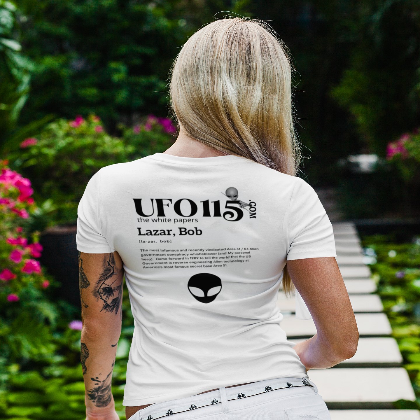 The White Papers My Man Bob T-shirt in White, back print, worn by a model (tropical garden walkway (back)). AI-edited photo: the real print artwork was digitally placed on a model photo.