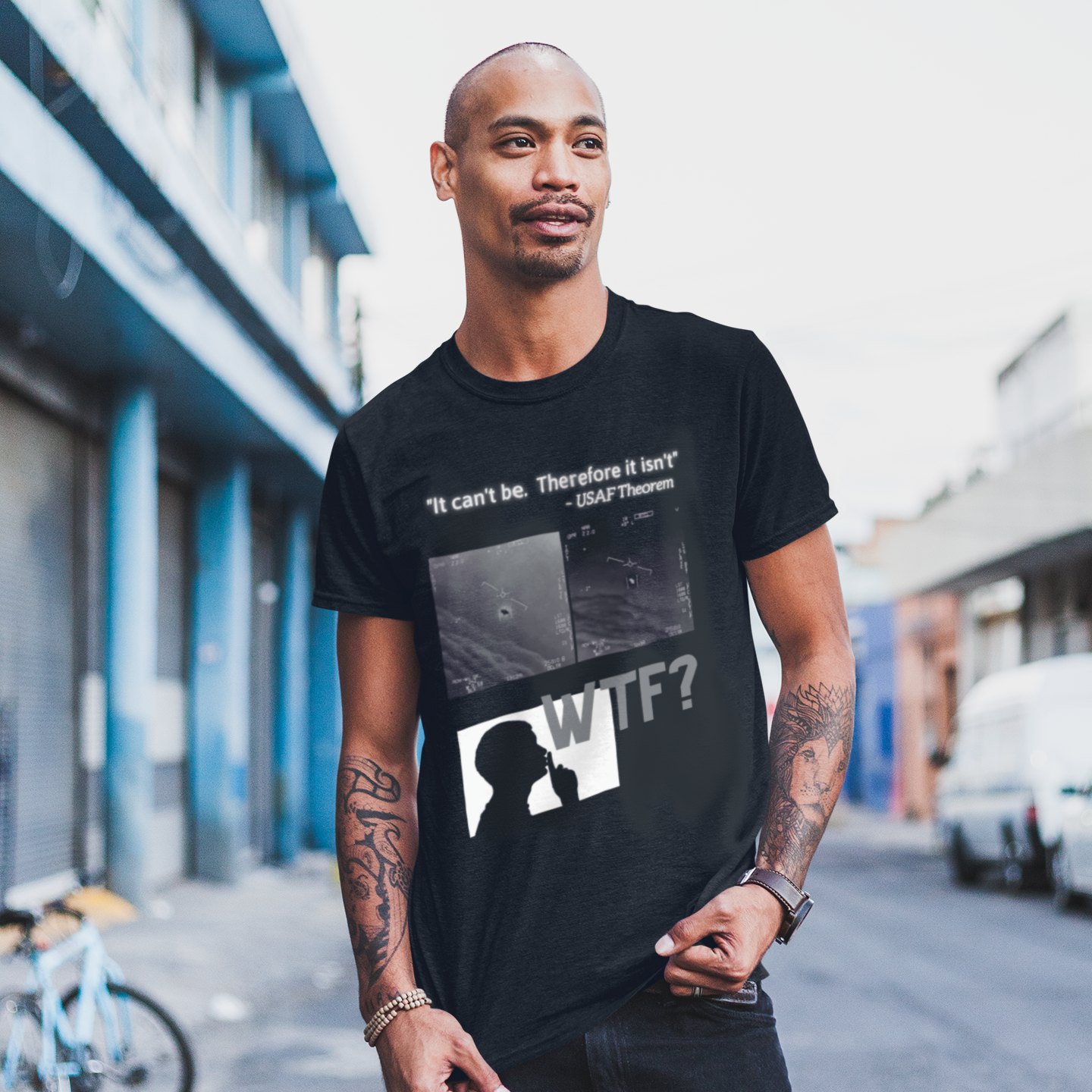 WTF Bad Kids T-shirt in Black, front print, worn by a model (city street, day). AI-edited photo: the real print artwork was digitally placed on a model photo.