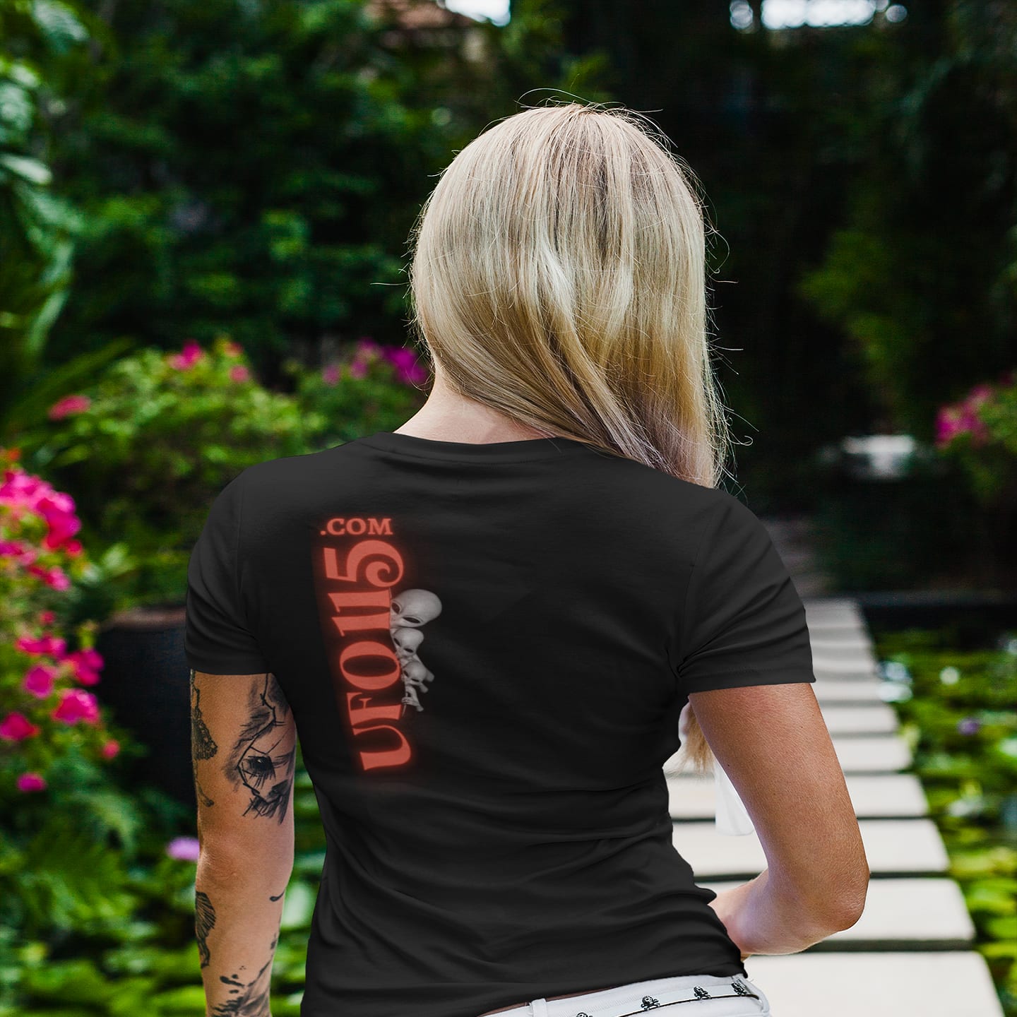 Model wearing the UFO115 Red Angel black T-shirt (back view, UFO115 back print)