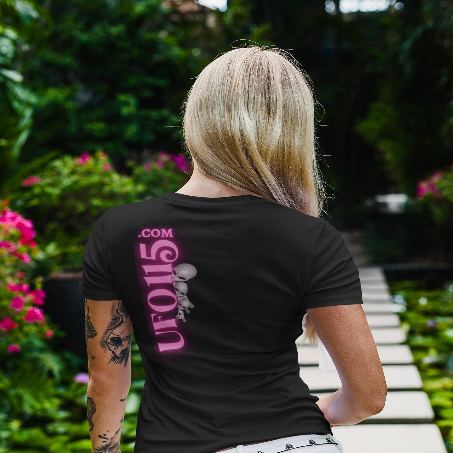 Model wearing the Have a Nice Day Alien black T-shirt (back view, UFO115 back print)