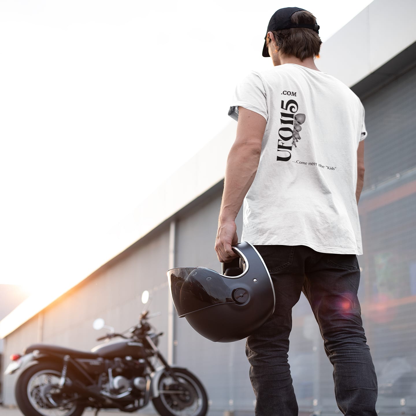 Model wearing the No More Secrets Alien Face white T-shirt (back view, UFO115 back print)
