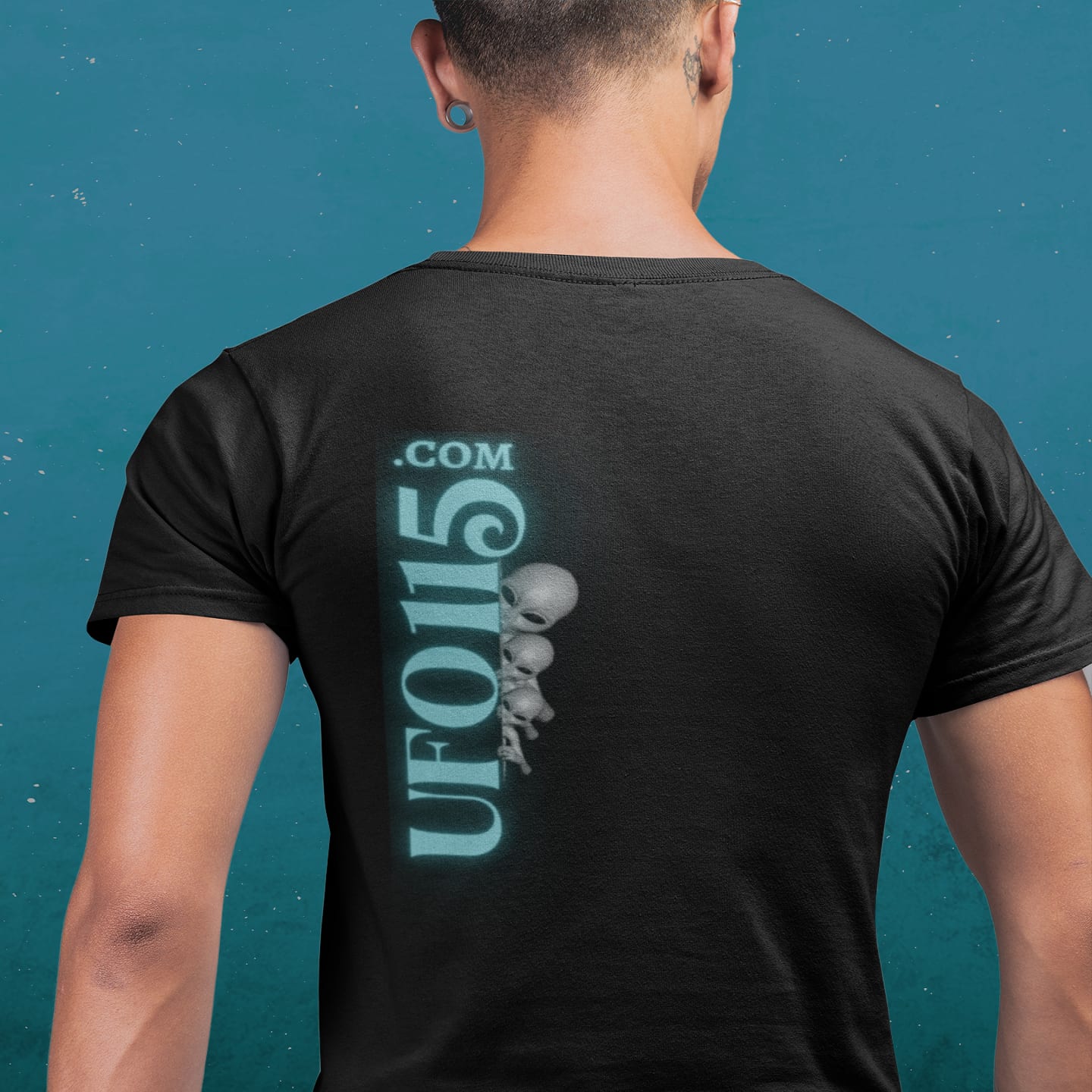 Model wearing the Truth Telling Bob black T-shirt (back view, UFO115 back print)