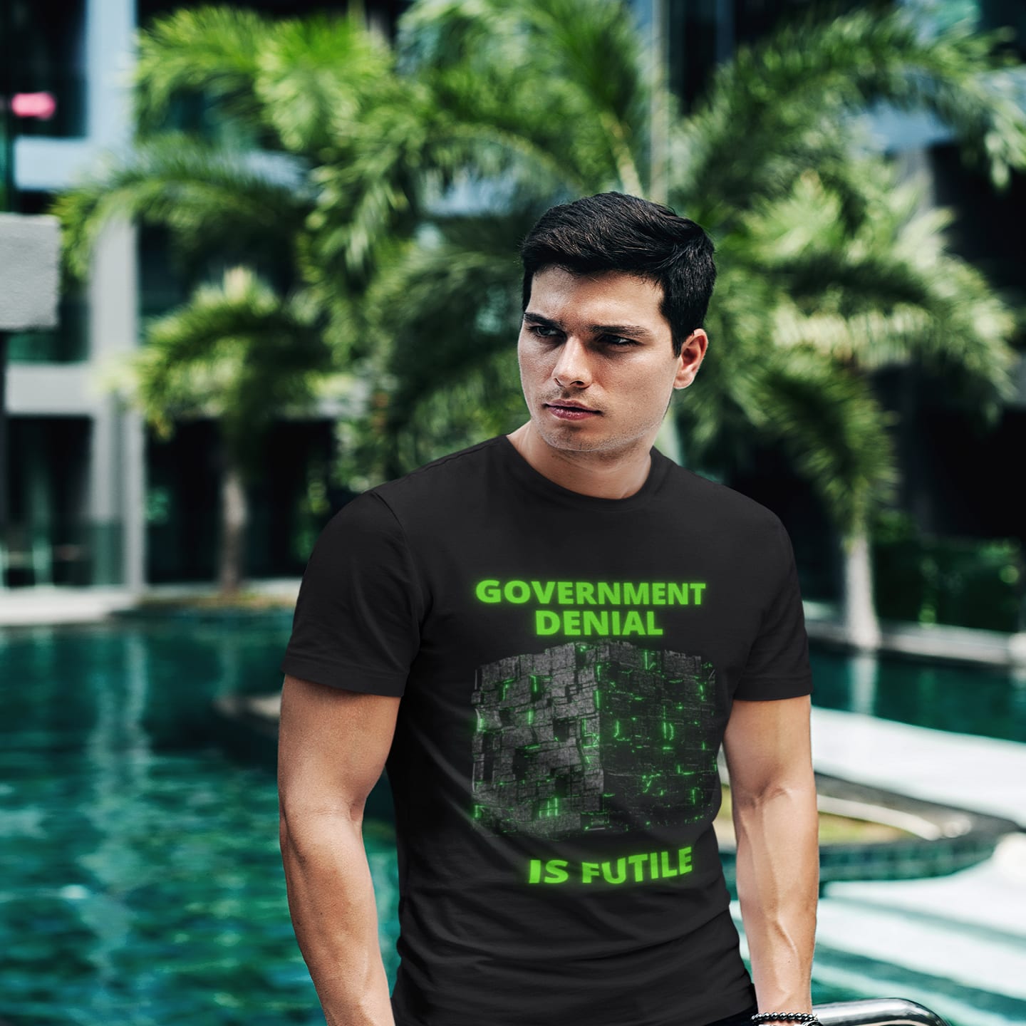 Model wearing the Government Denial Is Futile black T-shirt (front view)