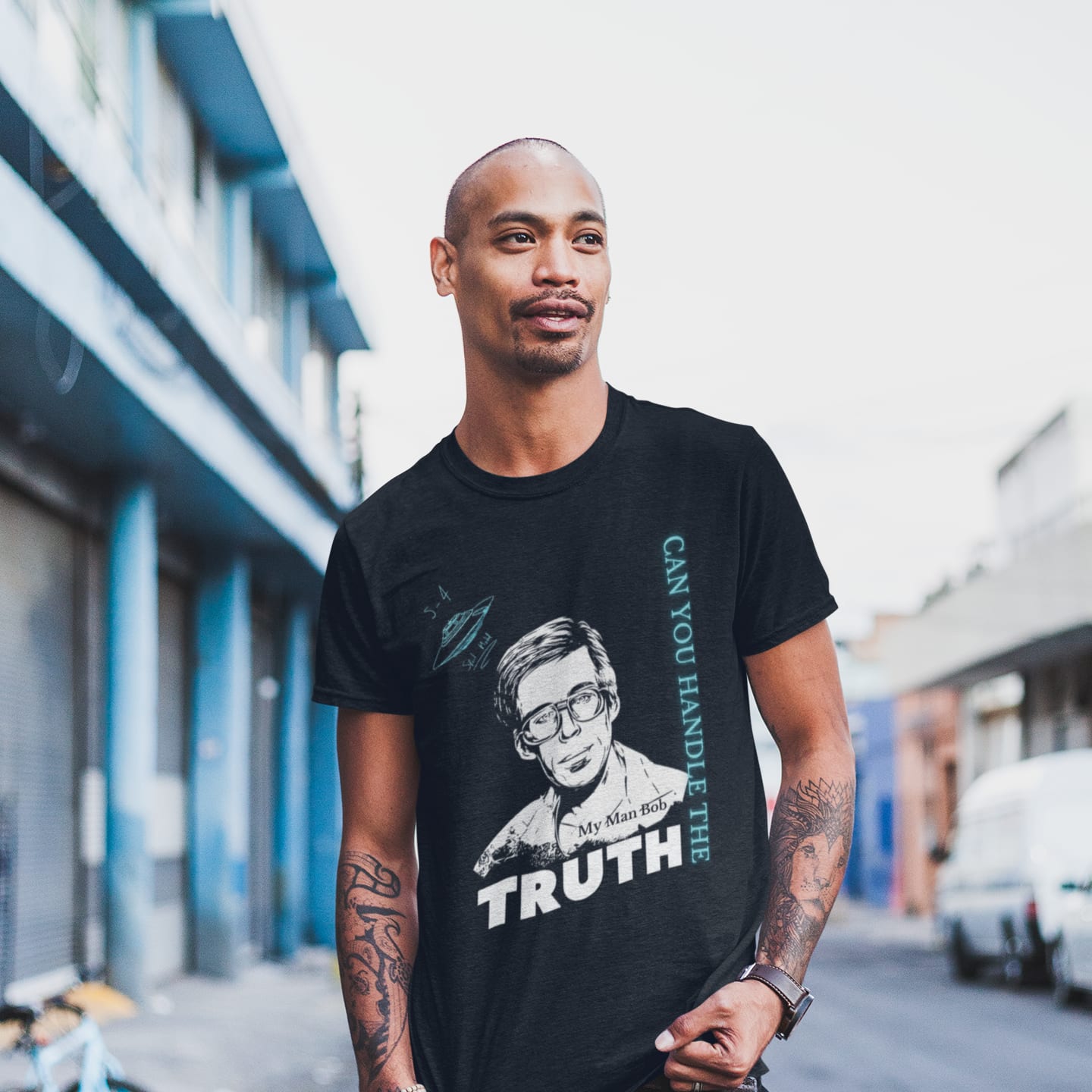 Model wearing the Truth Telling Bob black T-shirt (front view)