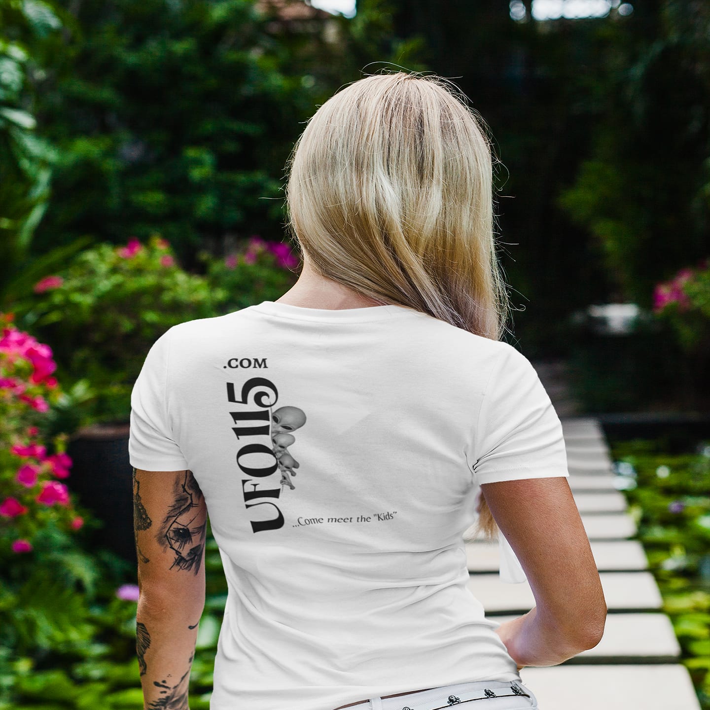Model wearing the No More Secrets Alien Face white T-shirt (back view, UFO115 back print)