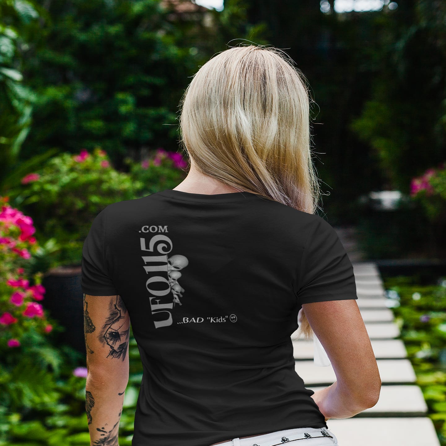 Model wearing the WTF Bad Kids black T-shirt (back view, UFO115 back print)