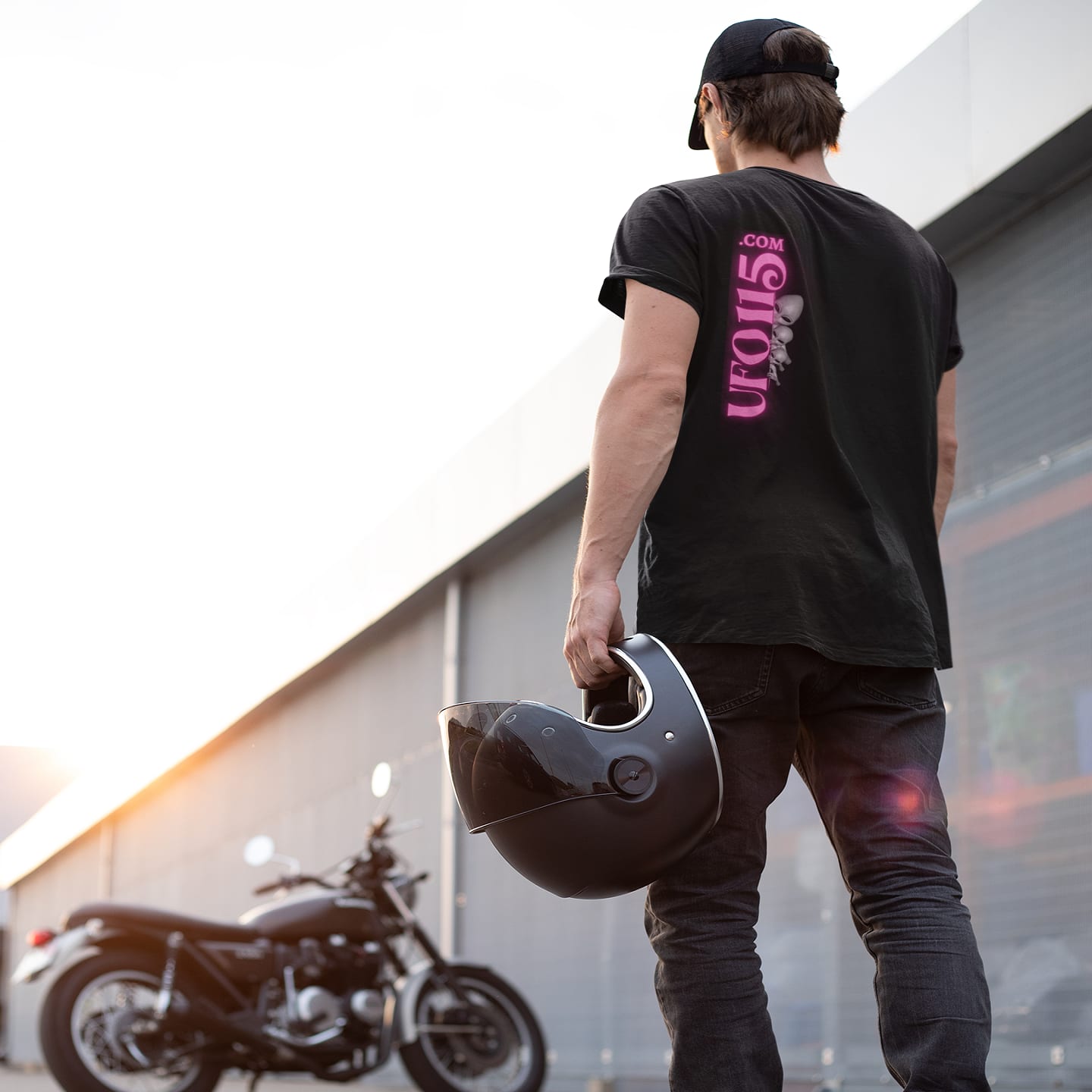 Model wearing the Have a Nice Day Alien black T-shirt (back view, UFO115 back print)