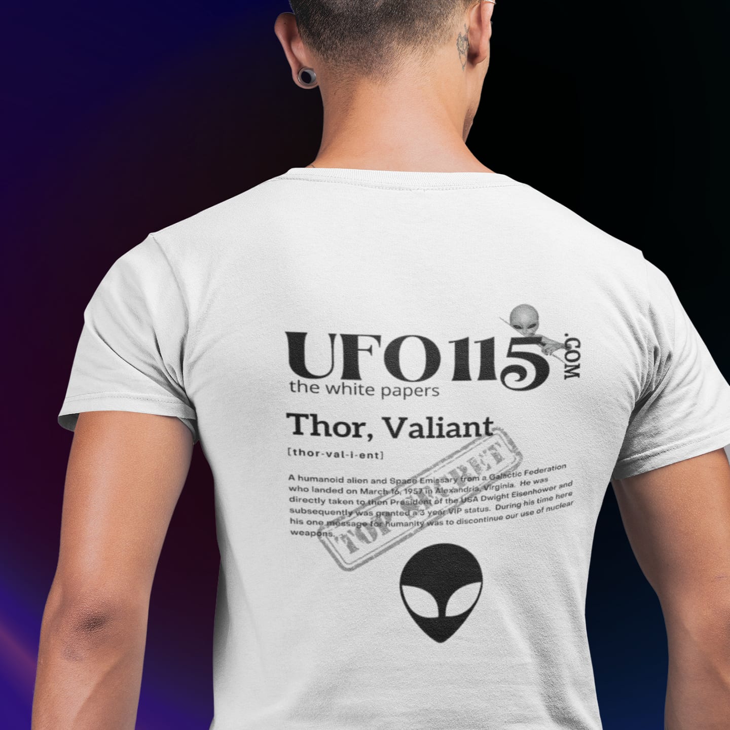 Model wearing the The White Papers Valiant Thor white T-shirt (back view, UFO115 back print)