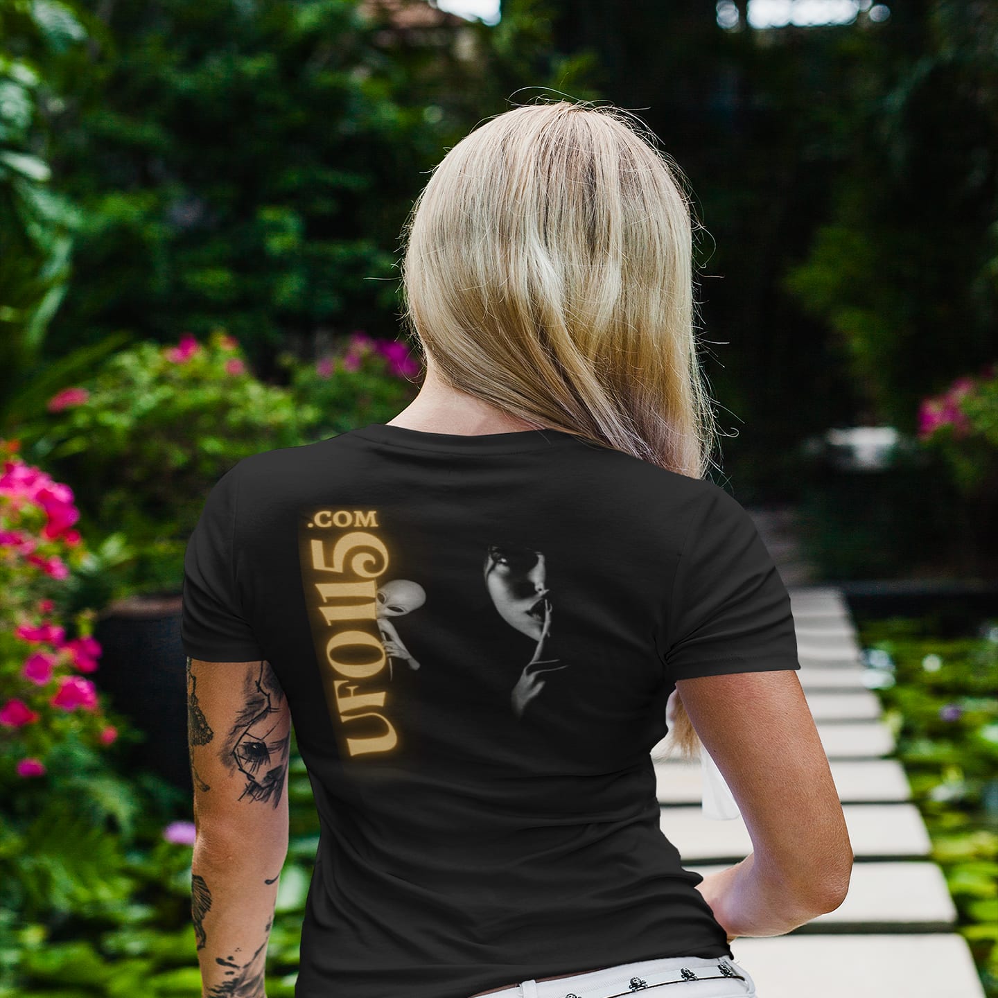 Model wearing the Uup 115 "You Never Saw Me" black T-shirt (back view, UFO115 back print)