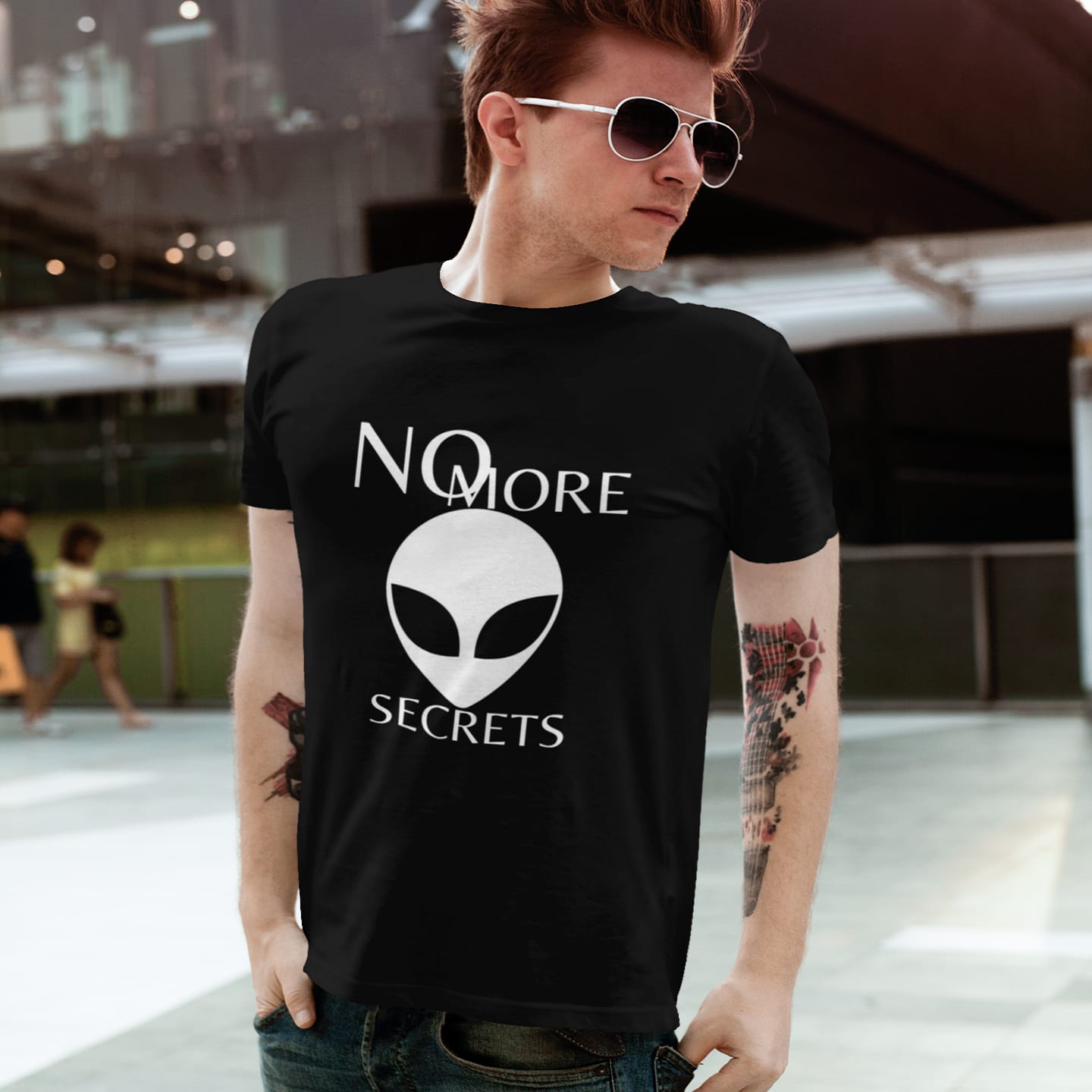 Model wearing the No More Secrets White Alien Face black T-shirt (front view)