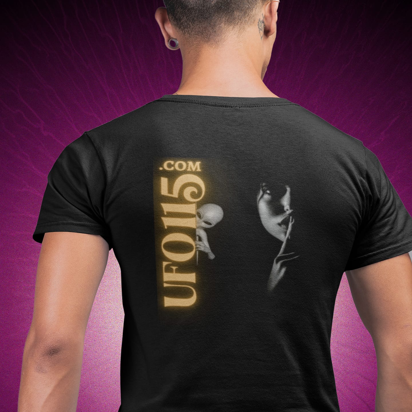 Model wearing the Uup 115 "You Never Saw Me" black T-shirt (back view, UFO115 back print)