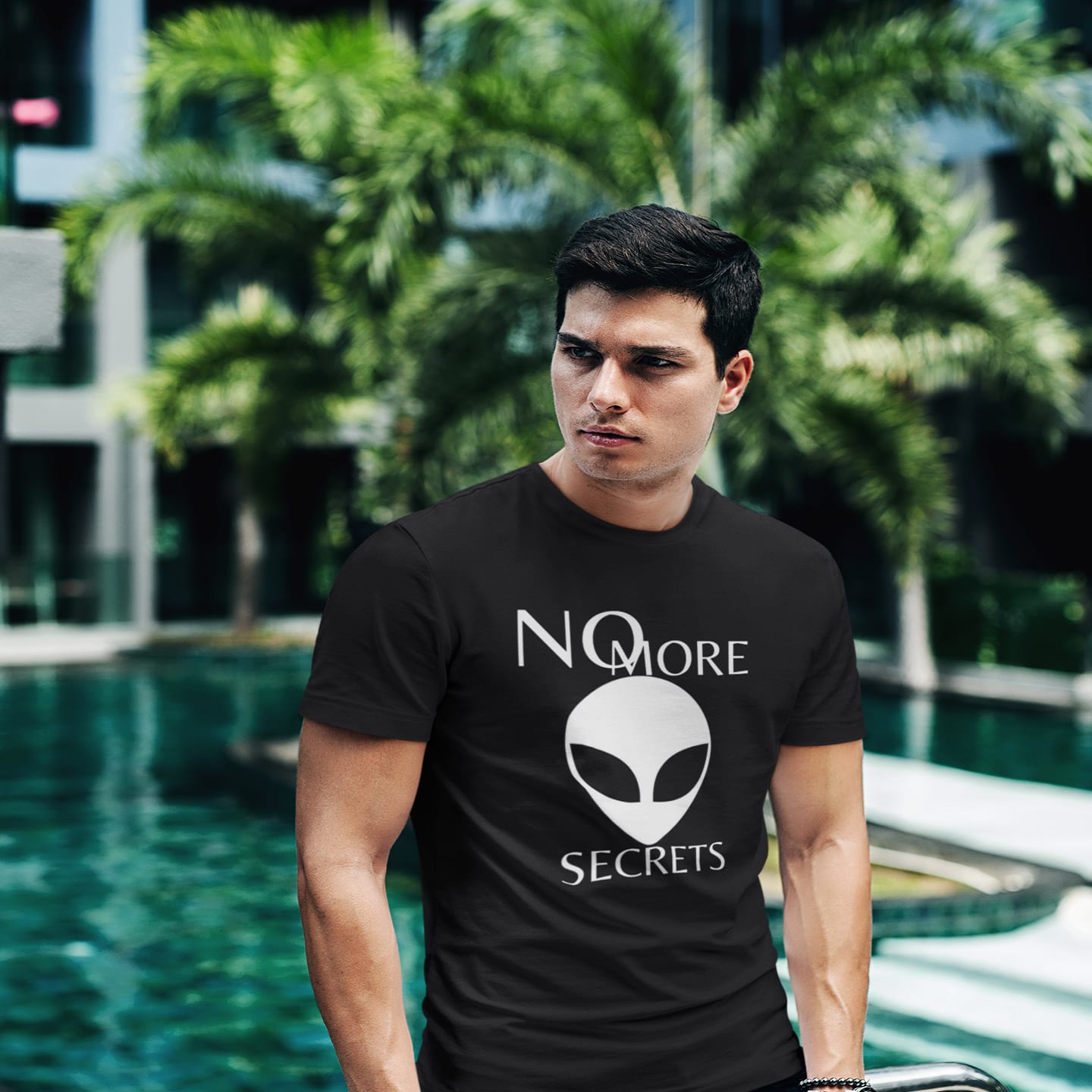 Model wearing the No More Secrets White Alien Face black T-shirt (front view)