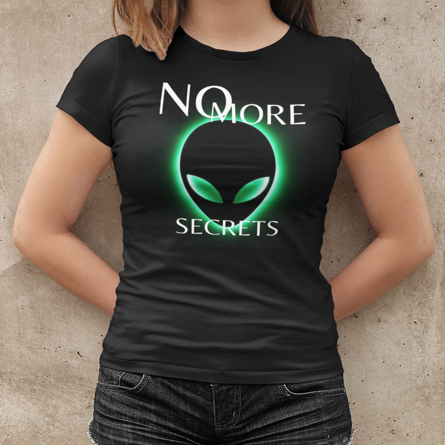 Model wearing the No More Secrets Green Glow Alien Face black T-shirt (front view)